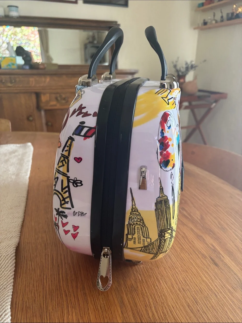 White Graphic Heart Dome Cosmetic Case with Black Handle and Colorful Print